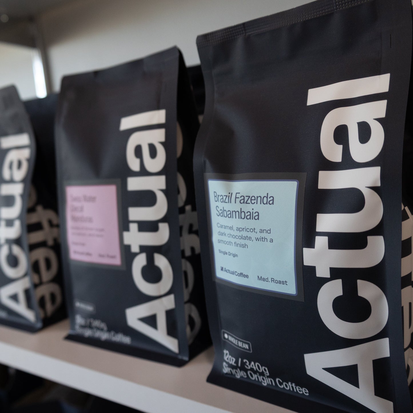 Row of 'Actual' coffee bags on a shelf