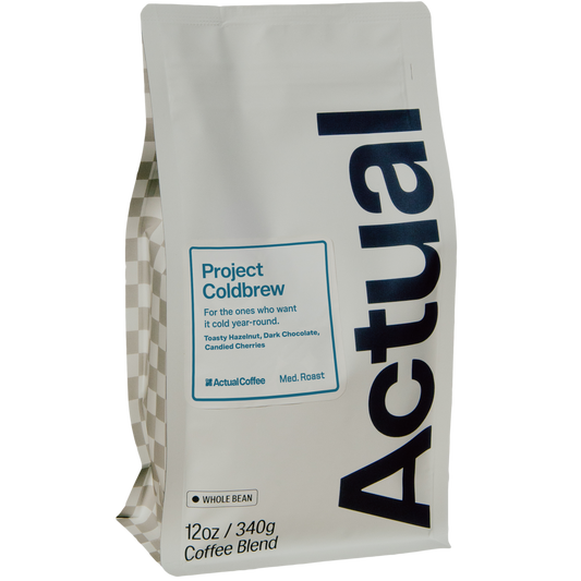 A 12oz bag of Actual Coffee's Project Coldbrew Whole Bean coffee blend, shown on a clean white background.