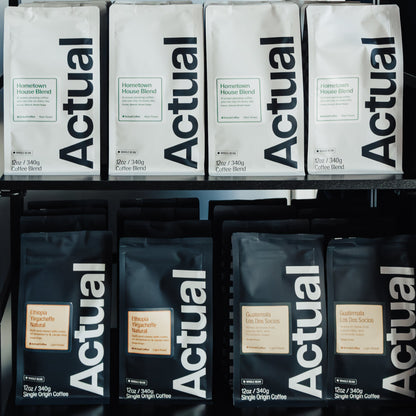 Display of 'Actual' products on a metal rack with a blurred background