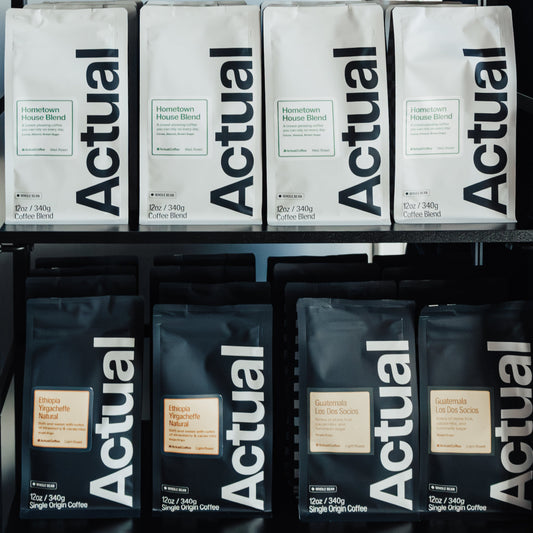 Display of 'Actual' products on a metal rack with a blurred background