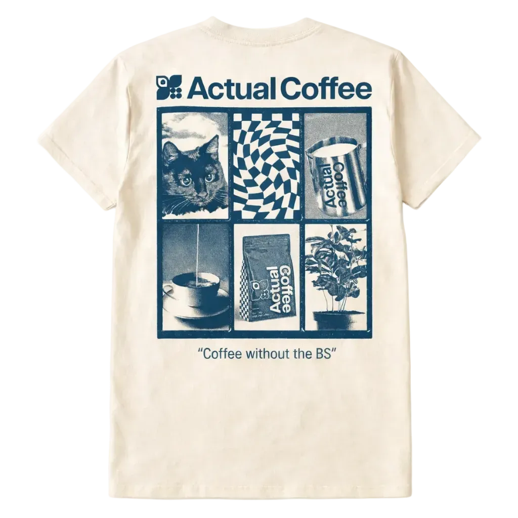 Beige t-shirt with blue graphic design featuring a cat, coffee cup, and text on a white background